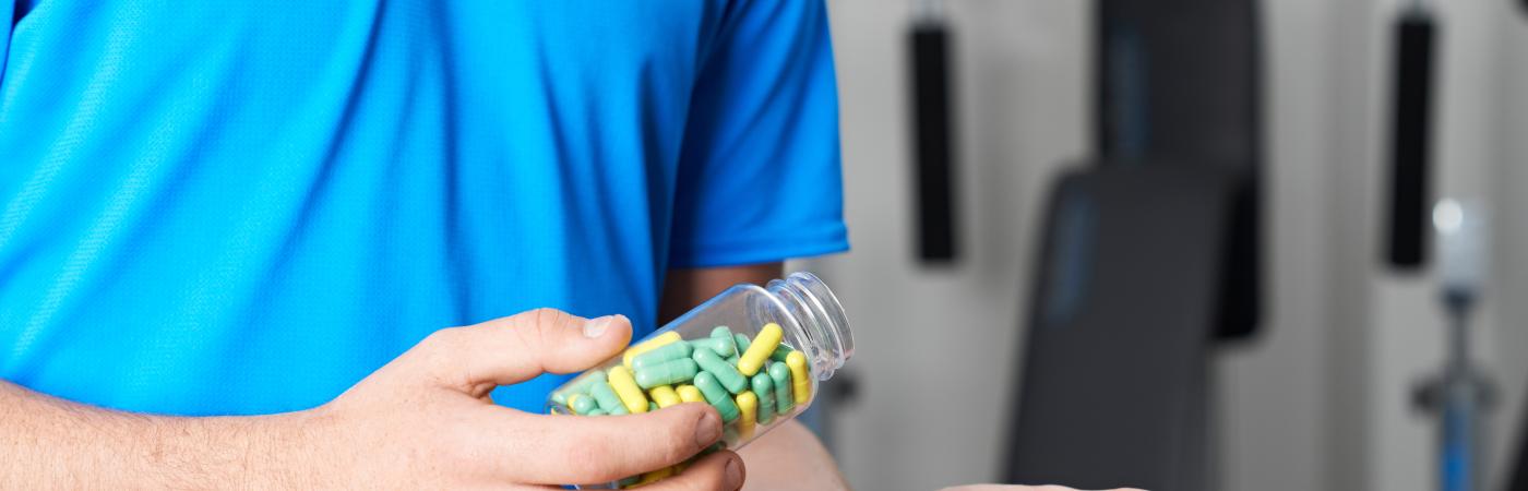 boy holding pills