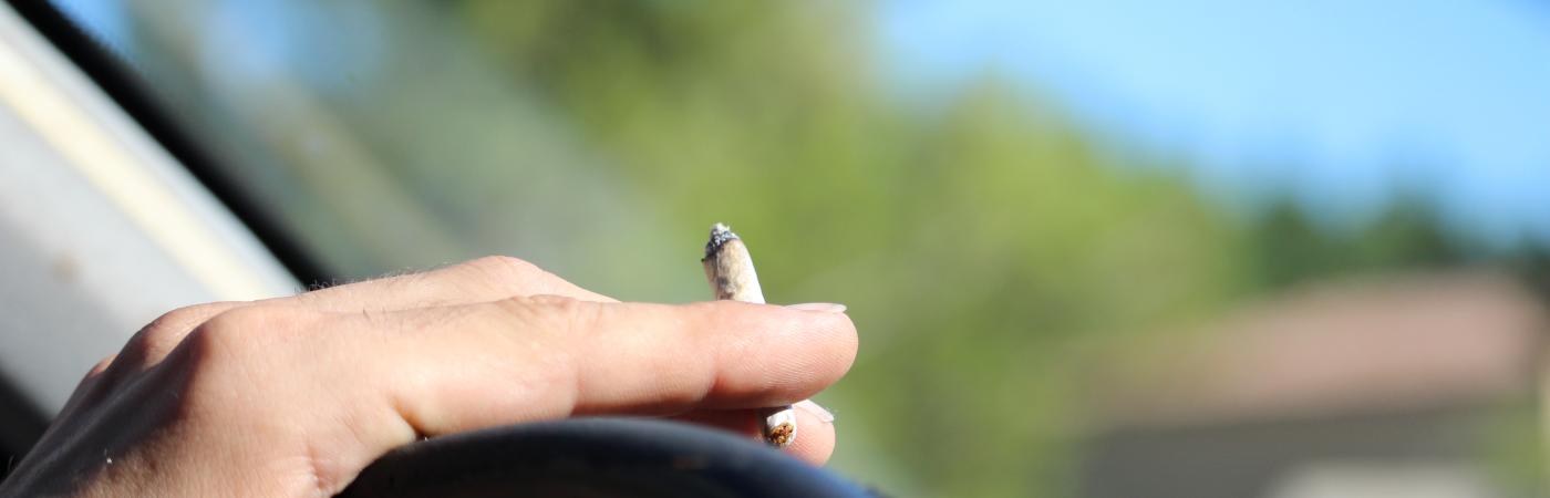 marijuana cigarette and steering wheel