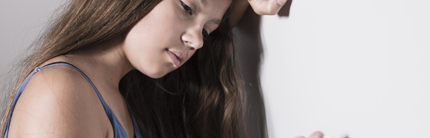 teen holding pills