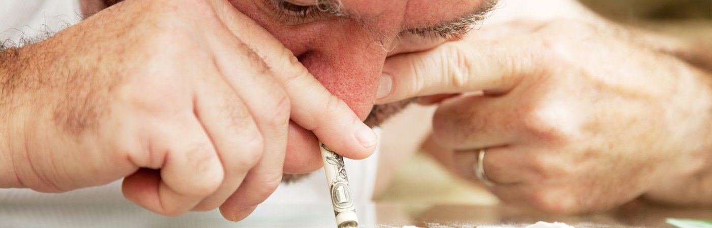 Man snorting cocaine