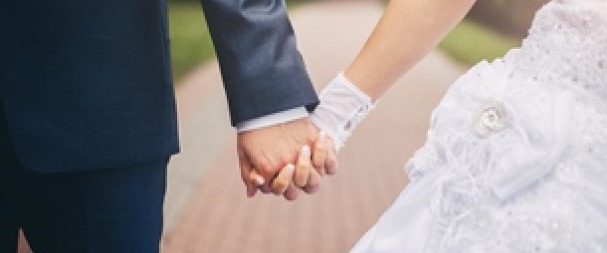 newlyweds holding hands