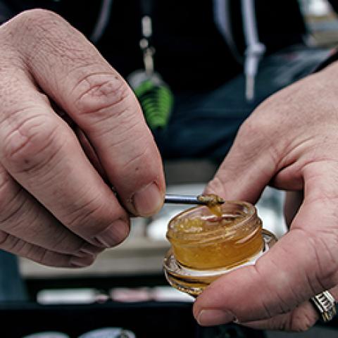 man holding marijuana concentrate