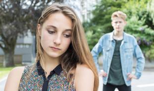 teen girl turning her back on boyfriend